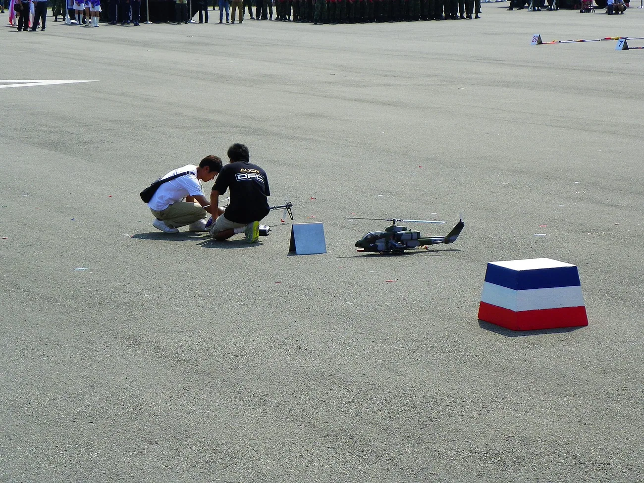 ALIGN DFC Team Checking Radio Controlled Model Helicopter before Demo Flight 20121006